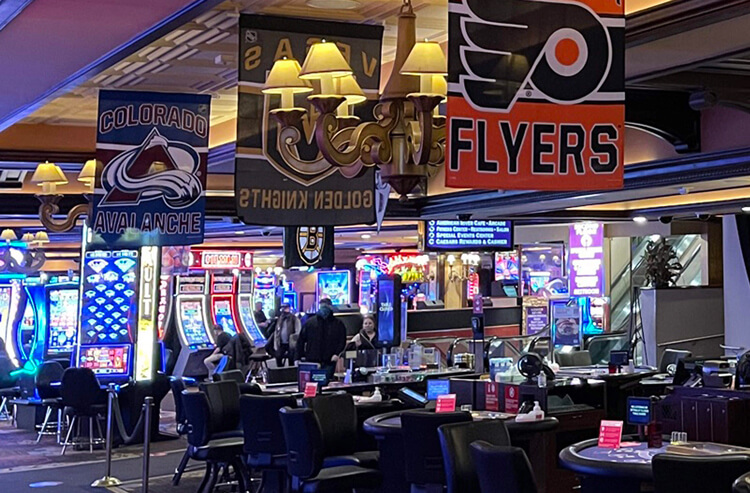 Interior of a casino with a prominent Philadelphia Flyers banner