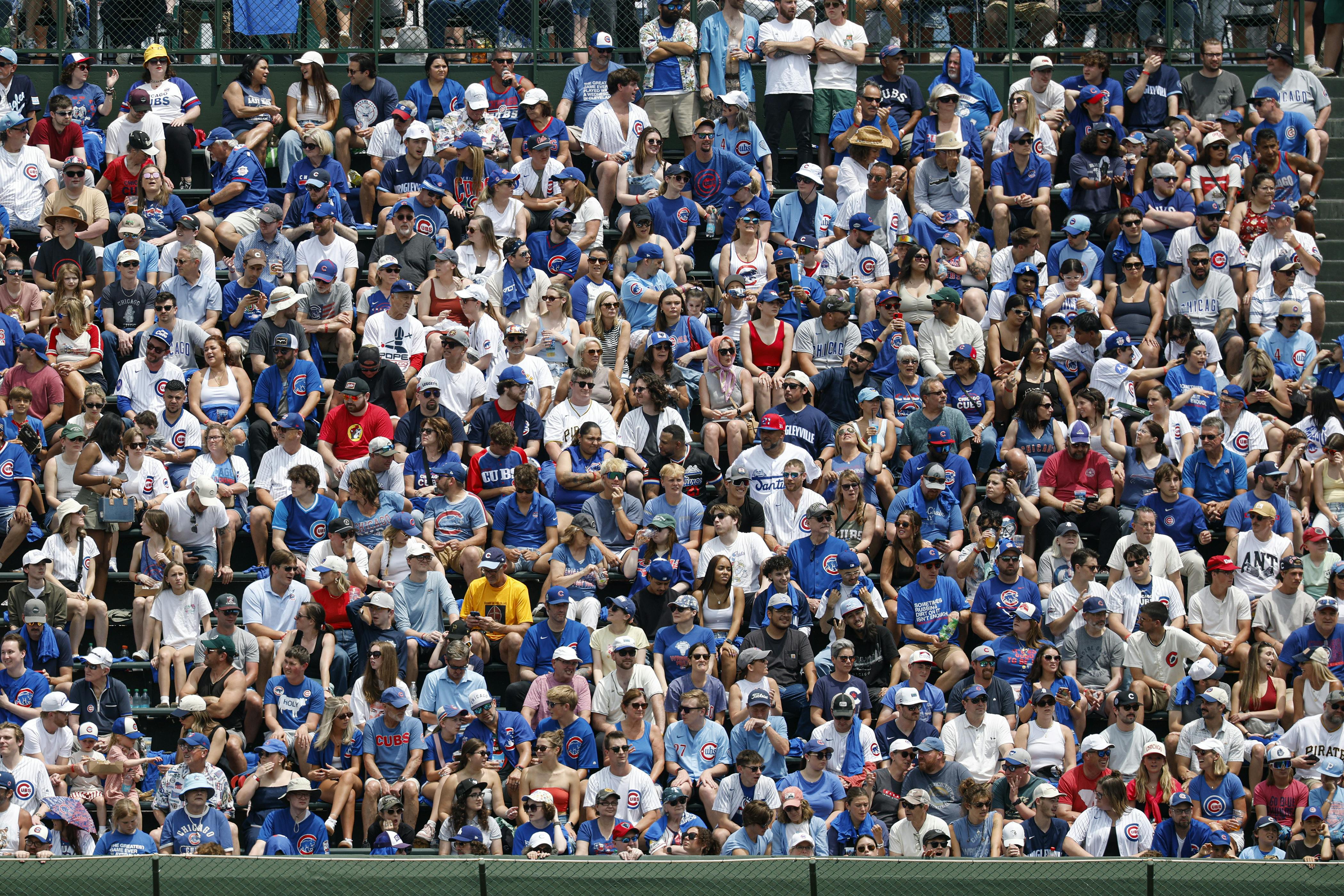 Fans watch a game between the Chicago Cubs and Pittsburgh Pirates during the first inning at Wrigley Field. Kamil Krzaczynski-Imagn Images