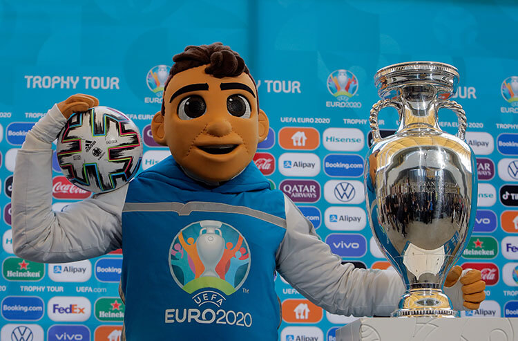 The UEFA Euro 2020 mascot and the European Football Championship trophy.