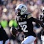 Colorado Buffaloes cornerback Travis Hunter (12) following an interception in the first quarter against the Oklahoma State Cowboys at Folsom Field. Mandatory Credit: Ron Chenoy-Imagn Images
