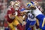 San Francisco 49ers running back Isaac Guerendo (31) runs the ball as Los Angeles Rams linebacker Byron Young (0) defends in the second quarter at Levi's Stadium. Mandatory Credit: Cary Edmondson-Imagn Images