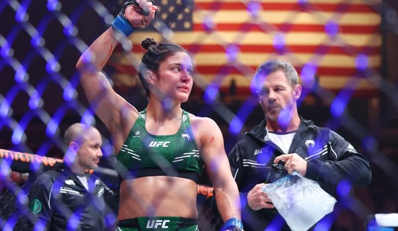  Loopy Godinez (blue gloves) reacts after her fight.