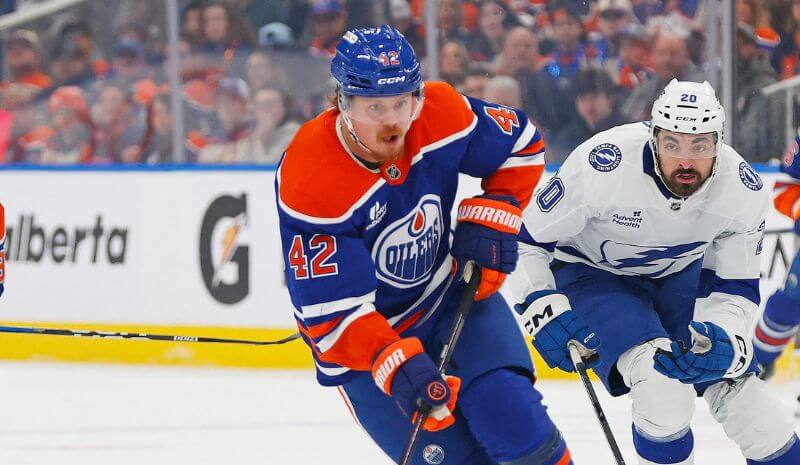 Edmonton Oilers forward Kasperi Kapanen (42) is chased up the ice.