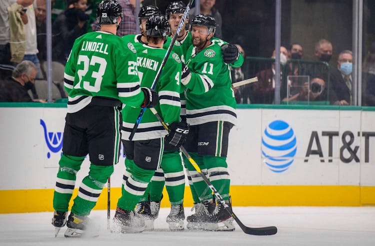 Dallas Stars defenseman Esa Lindell (23) and defenseman Miro Heiskanen (4) and left wing Michael Raffl (18) and center Luke Glendening (11) and right wing Denis Gurianov (34) celebrate a goal by Raffl against the Colorado Avalanche during the first period 