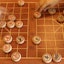 Overhead shot of players playing Chinese chess