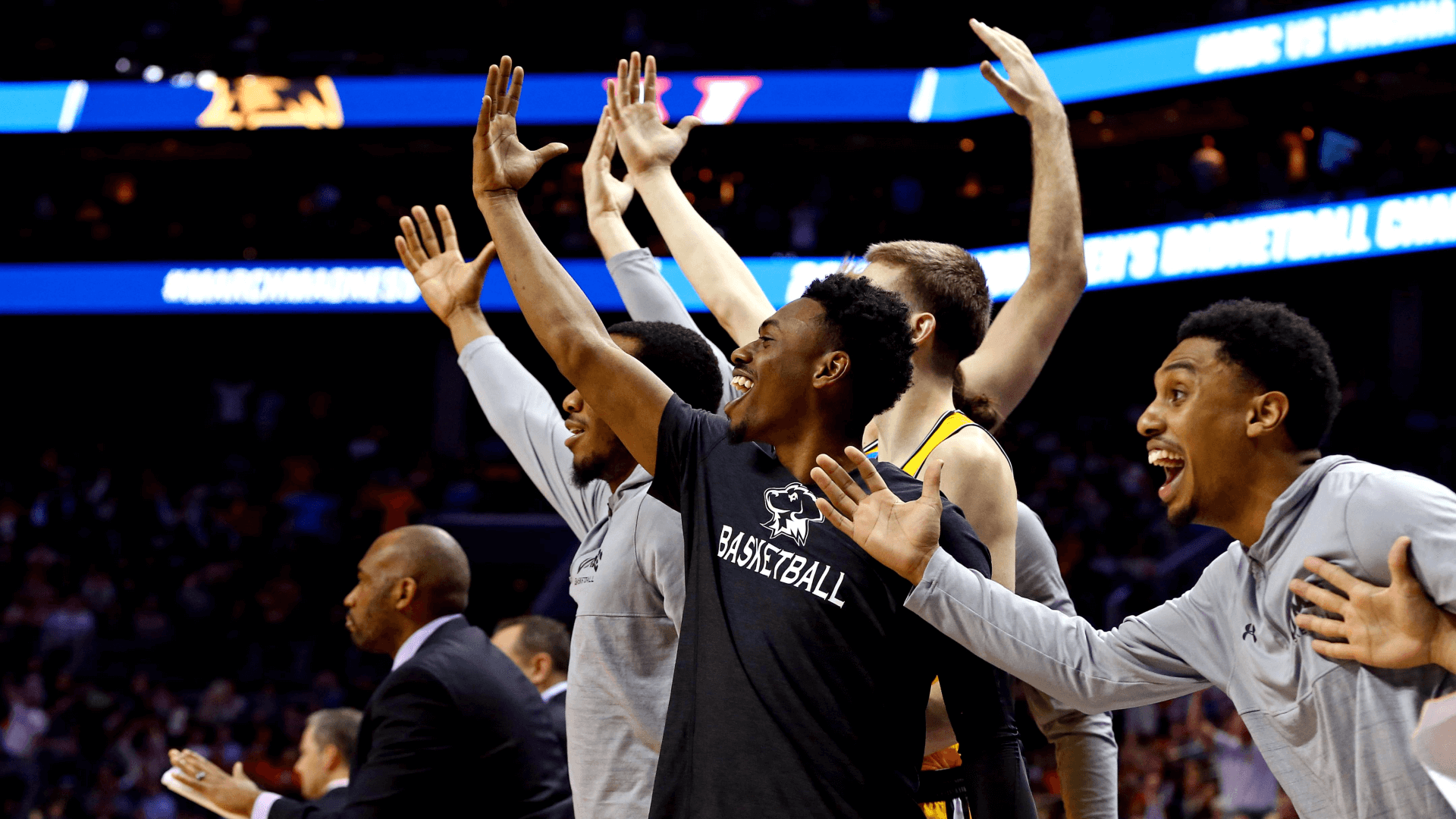 The UMBC Retrievers bench reacts during the second half against the Virginia Cavaliers.