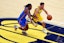 Indiana Pacers guard T.J. McConnell (9) drives to the basket against Oklahoma City Thunder guard Cason Wallace (22) in Game 3 of the 2025 NBA Finals at Gainbridge Fieldhouse. Trevor Ruszkowski-Imagn Images