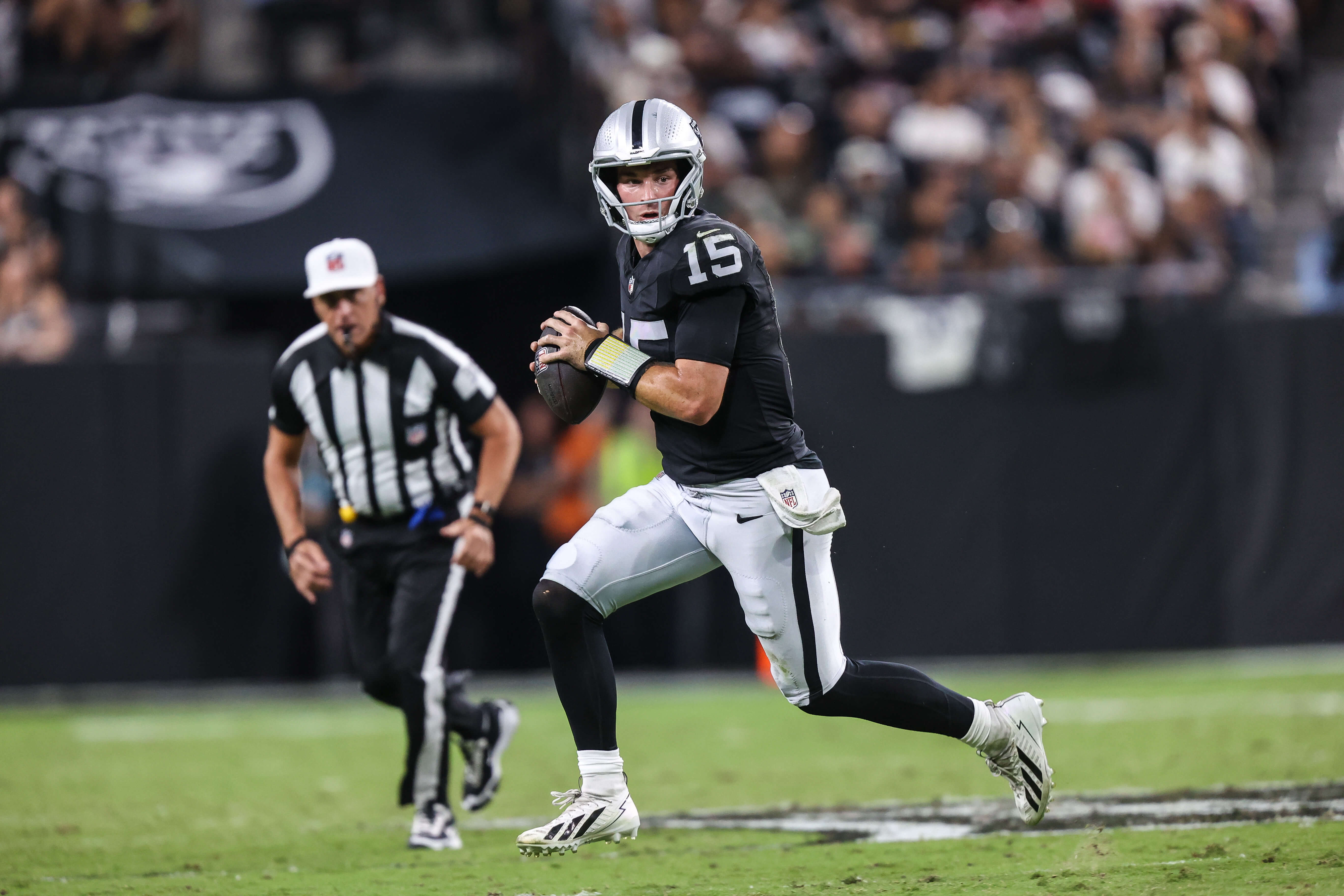 NFL AI predictions Week 1, Las Vegas Raiders quarterback Fernando Mendoza (15) rolls out of the pocket.