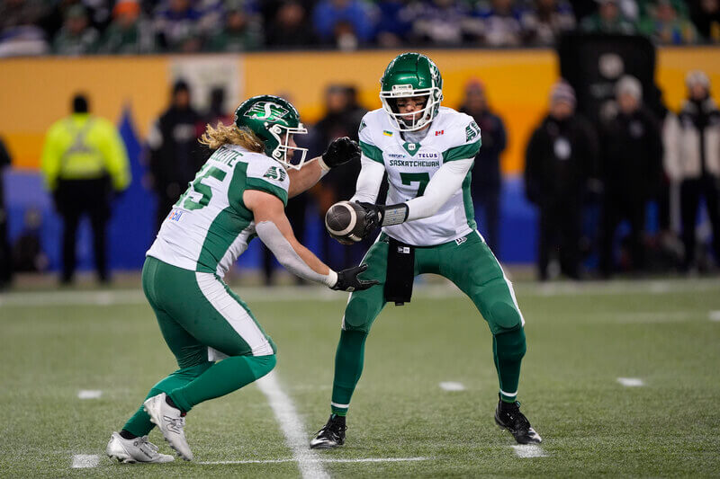 Saskatchewan Roughriders quarterback Trevor Harris (7) hands off the ball.