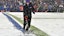 Snow is cleared from the field during an NFL game.