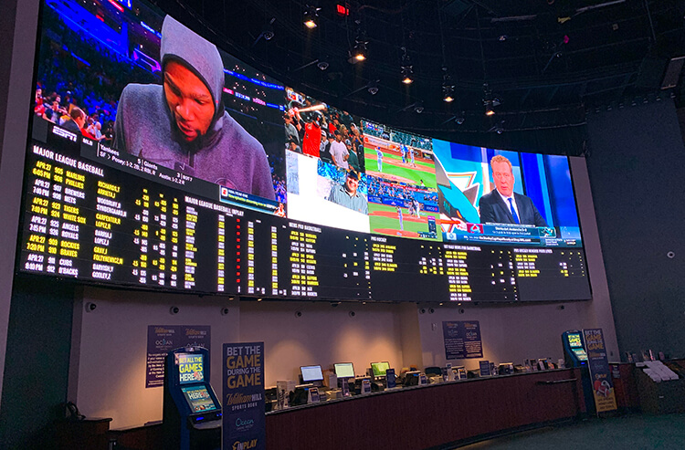 One of two giant video walls at the William Hill Sportsbook at Ocean Resort Atlantic City is one of the most luxurious sportsbooks in all of New Jersey.