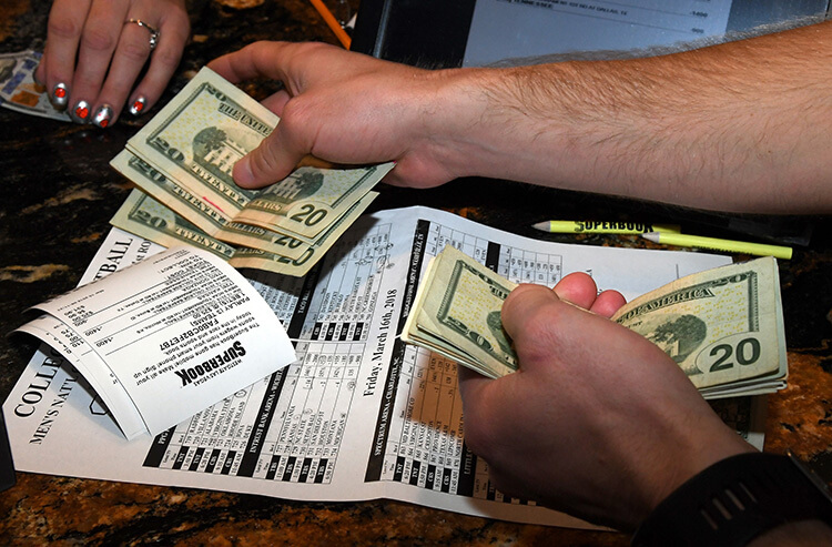 Money exchanges hands at the Westgate Las Vegas SuperBook