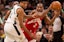 Raptors' Kawhi Leonard is guarded by Bucks' Giannis Antetokoumnpo.