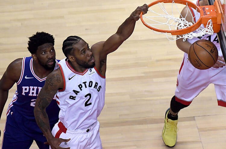 Kawhi Leonard dunks against the 76ers in Game 1.