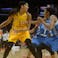 Basketball player Candace Parker handles the ball in WNBA action. 