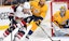 Arizona's Taylor Hall protects the puck from Nashville's Roman Josi in NHL action.