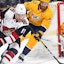 Arizona's Taylor Hall protects the puck from Nashville's Roman Josi in NHL action.