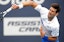 Novak Djokovic returns a serve.