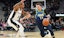 Luka Doncic of the Dallas Mavericks against the San Antonio Spurs' Demar DeRozan