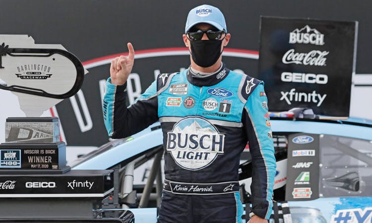 Kevin Harvick wears a mask while celebrating his win at Darlington Sunday.