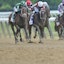Horses race in the Belmont Stakes.