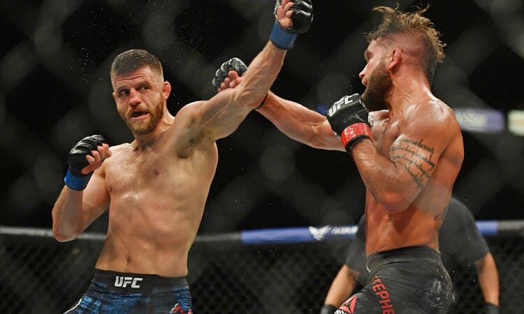 MMA fighter Calvin Kattar throws a punch in UFC action.