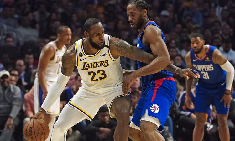 LeBron James and Kawhi Leonard battle in NBA action.