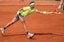 Rafael Nadal reaches for a forehand during a French Open match.