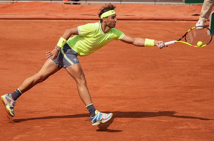 Rafael Nadal reaches for a forehand during a French Open match.