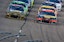 NASCAR drivers line up early in a race.