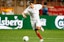 Sevilla captain Jesus Navas dribbles the ball in soccer action. 