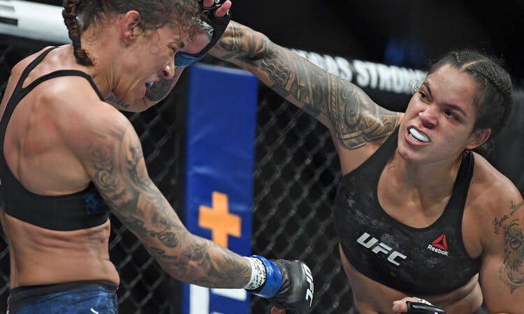 Amanda Nunes punches Germaine de Randamie during their fight at UFC 245.