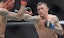 Dustin Poirier fights Khabib Nurmagomedov in UFC action.