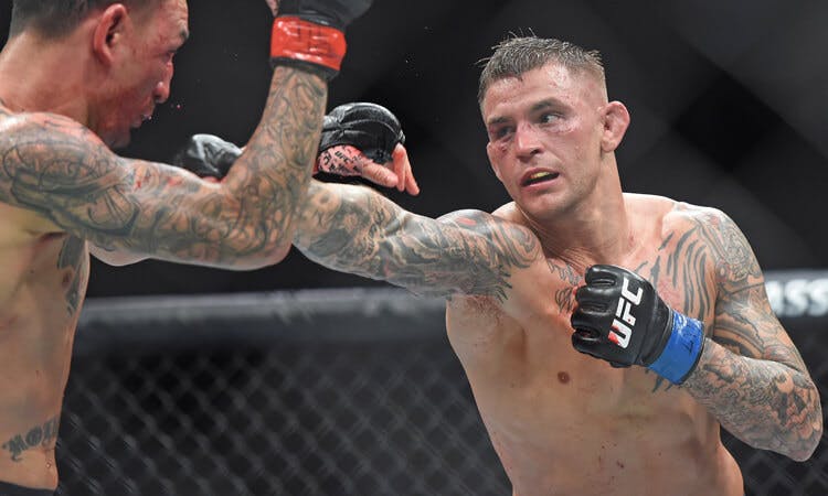 Dustin Poirier fights Khabib Nurmagomedov in UFC action.