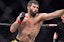 MMA fighter Raphael Raphael Assunção throws a punch in UFC action.