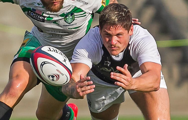 Rugby players scramble for the ball