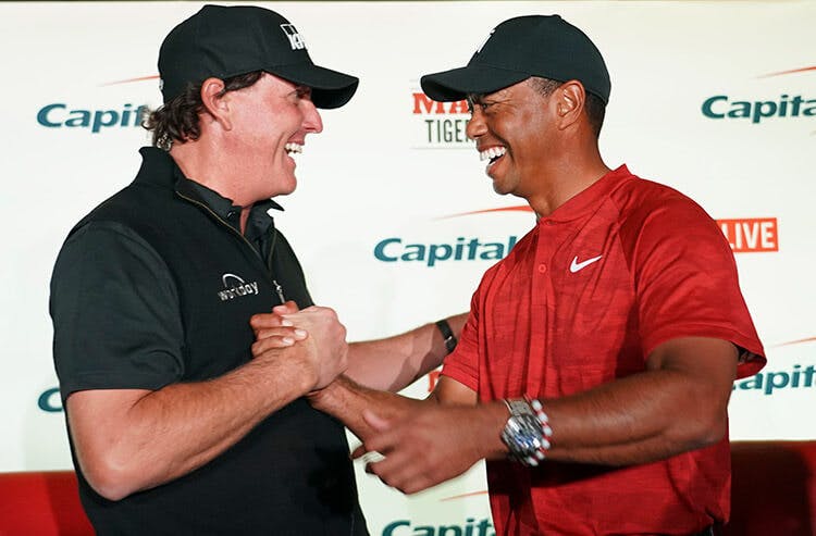 Golfers Tiger Woods and Phil Mickelson play against each other in "The Match"